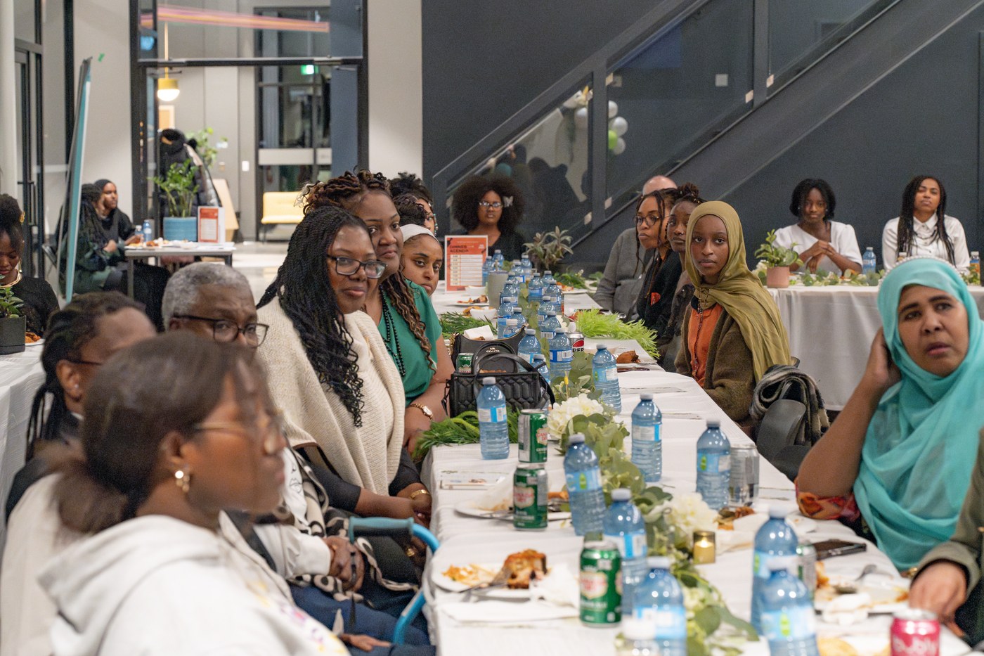 Community members gathered at long tables for the Rest as Resilience dinner